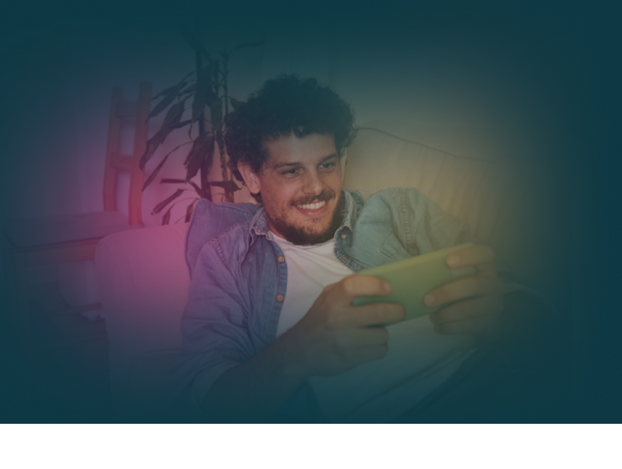 Smiling man using mobile at home.