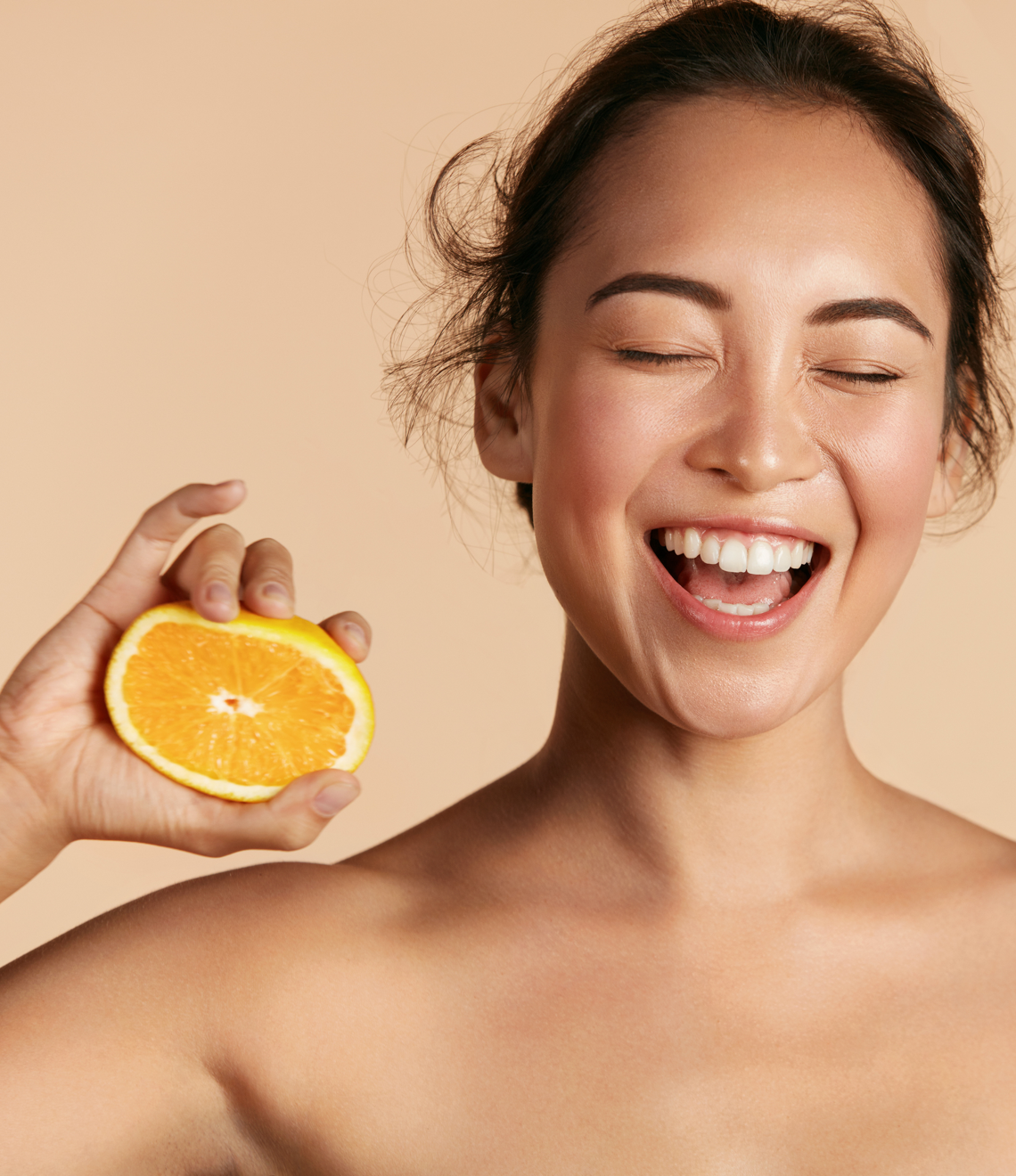 smiling person with orange